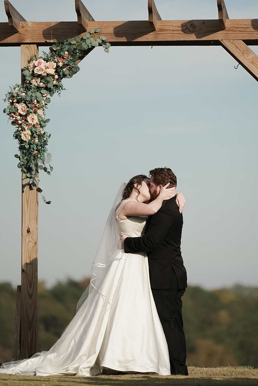 Skyline Events and Socials Wedding Ceremony First Kiss